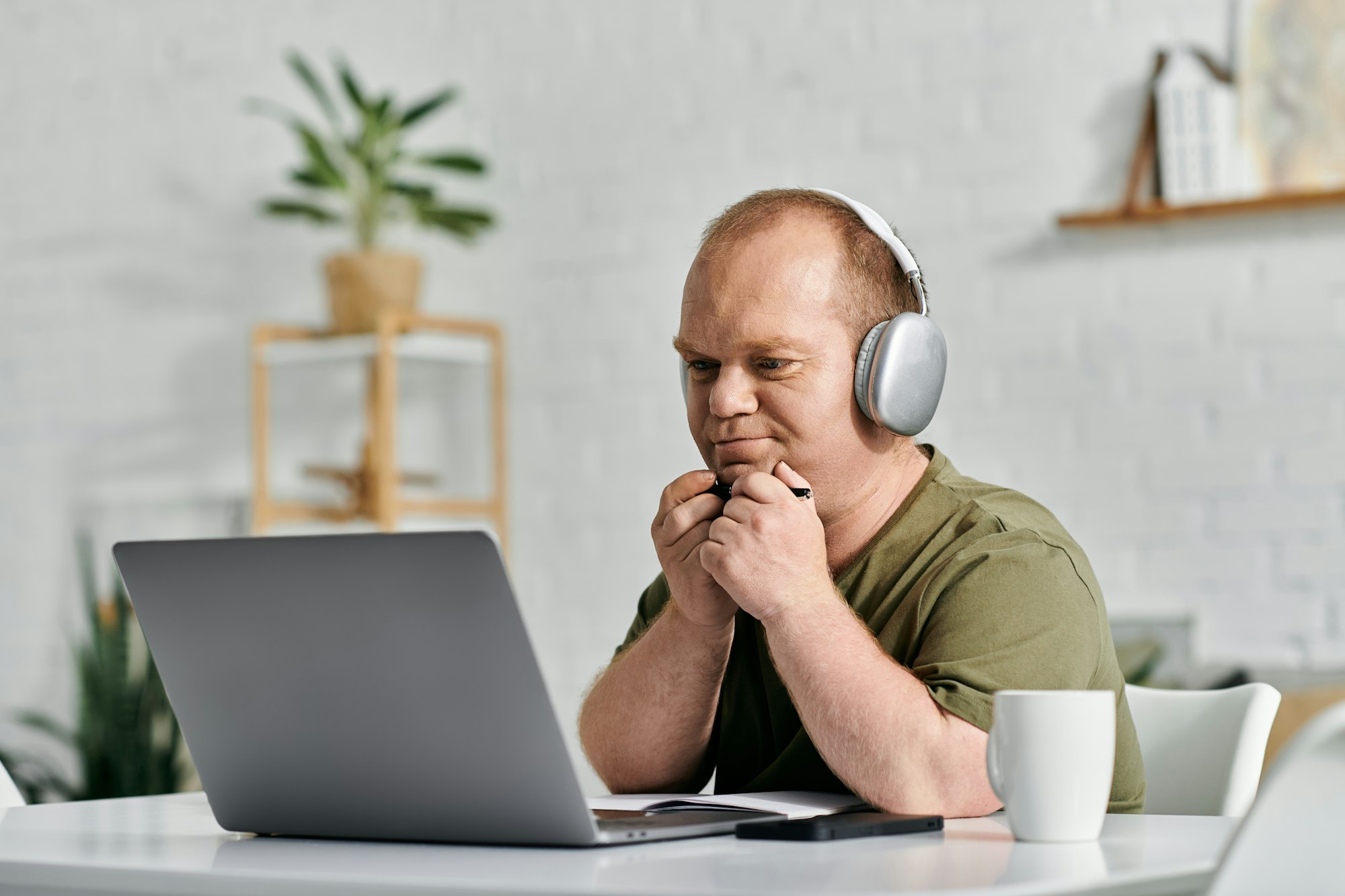 Man Working on Laptop in Home Office