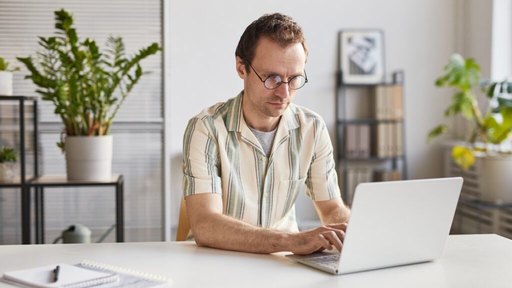 Man Working On Laptop